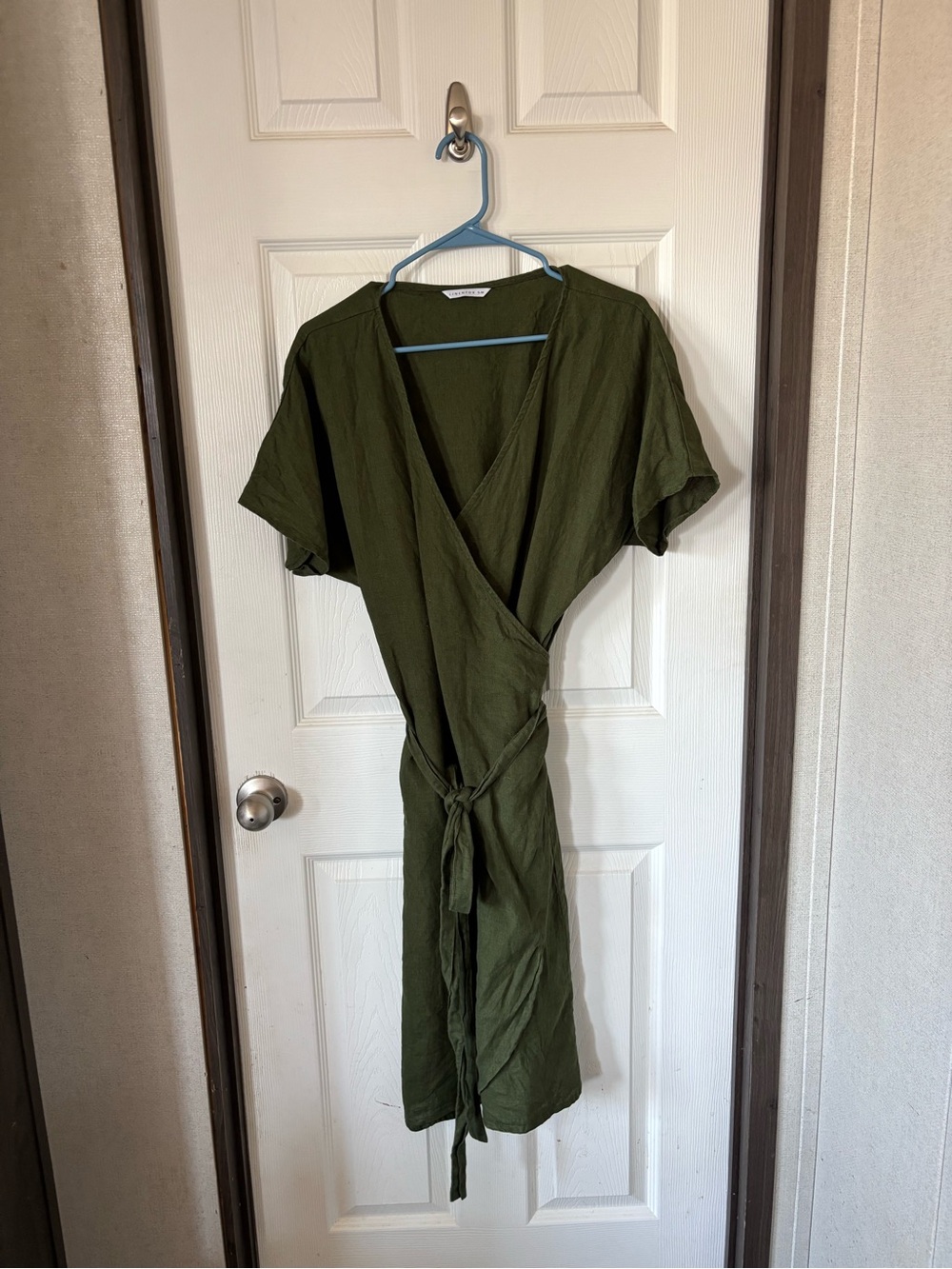 LINENFOX S-M label on green garment